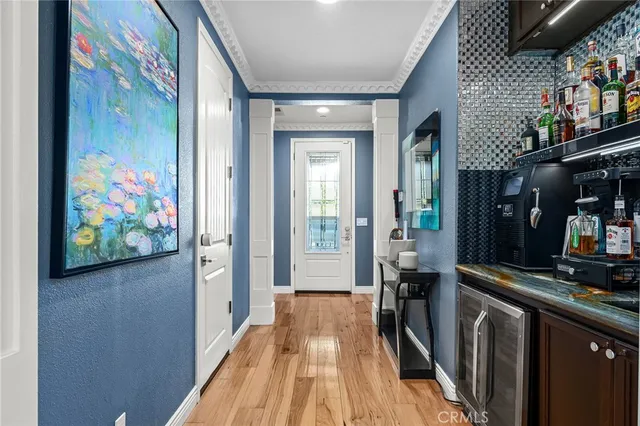 a view of a hallway and wooden floor