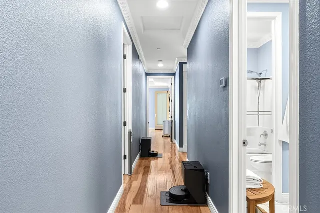 a bathroom with a granite countertop sink mirror and a shower