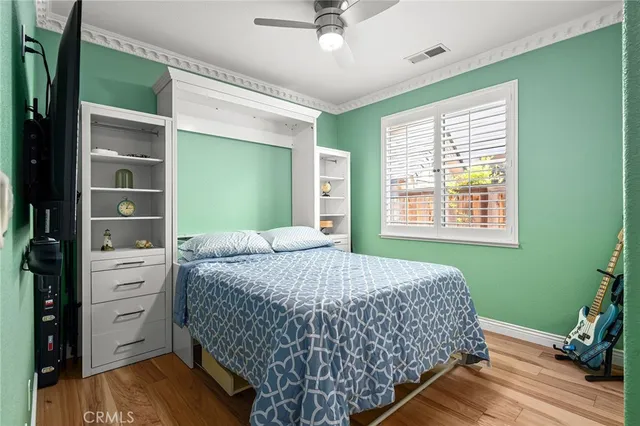 a room with gym equipment and a flat screen tv