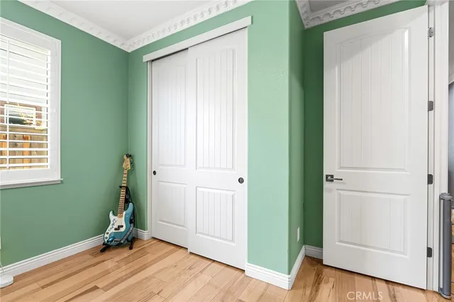 a view of a workspace with furniture and wooden floor