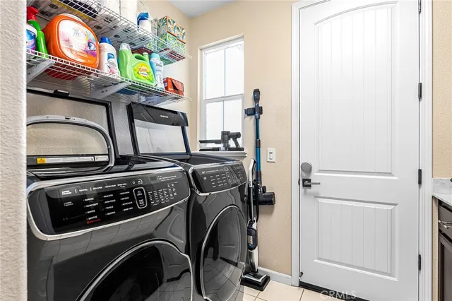 a view of a house with garden and sitting area