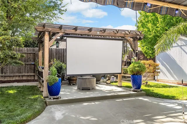 a view of a sitting area with furniture and wooden fence