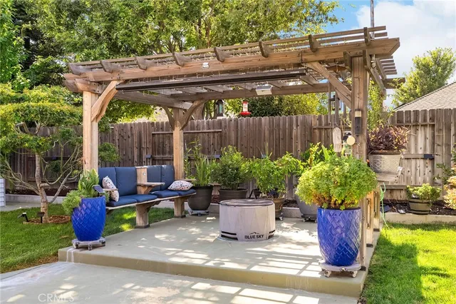 a view of a backyard with plants and a patio