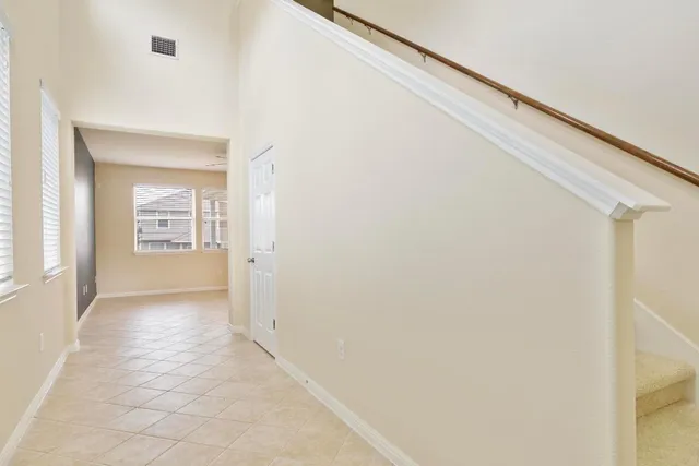 a view of a hallway with wooden shelves