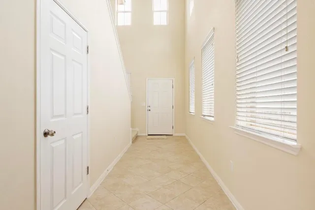 a view of a hallway with windows