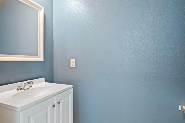 a bathroom with a sink and a vanity