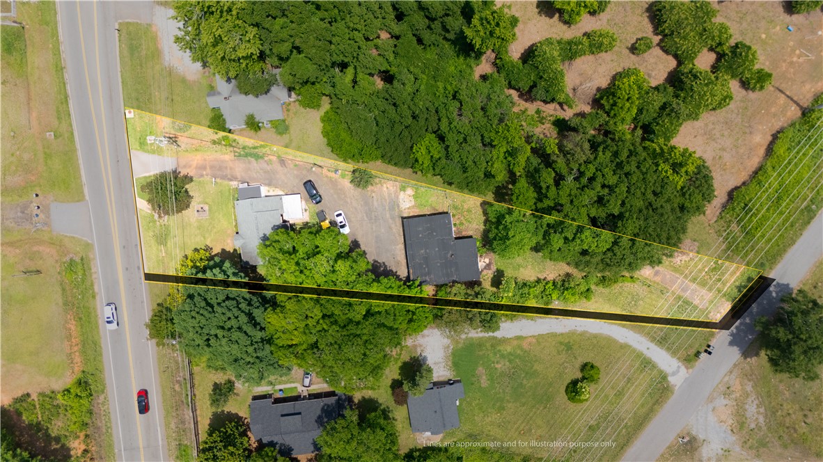 608 29 N Bypass Anderson, SC 29621 - Photo 15 of 20 An aerial perspective reveals the expansive land surrounding this property, bordered by green foliage and a roadway.