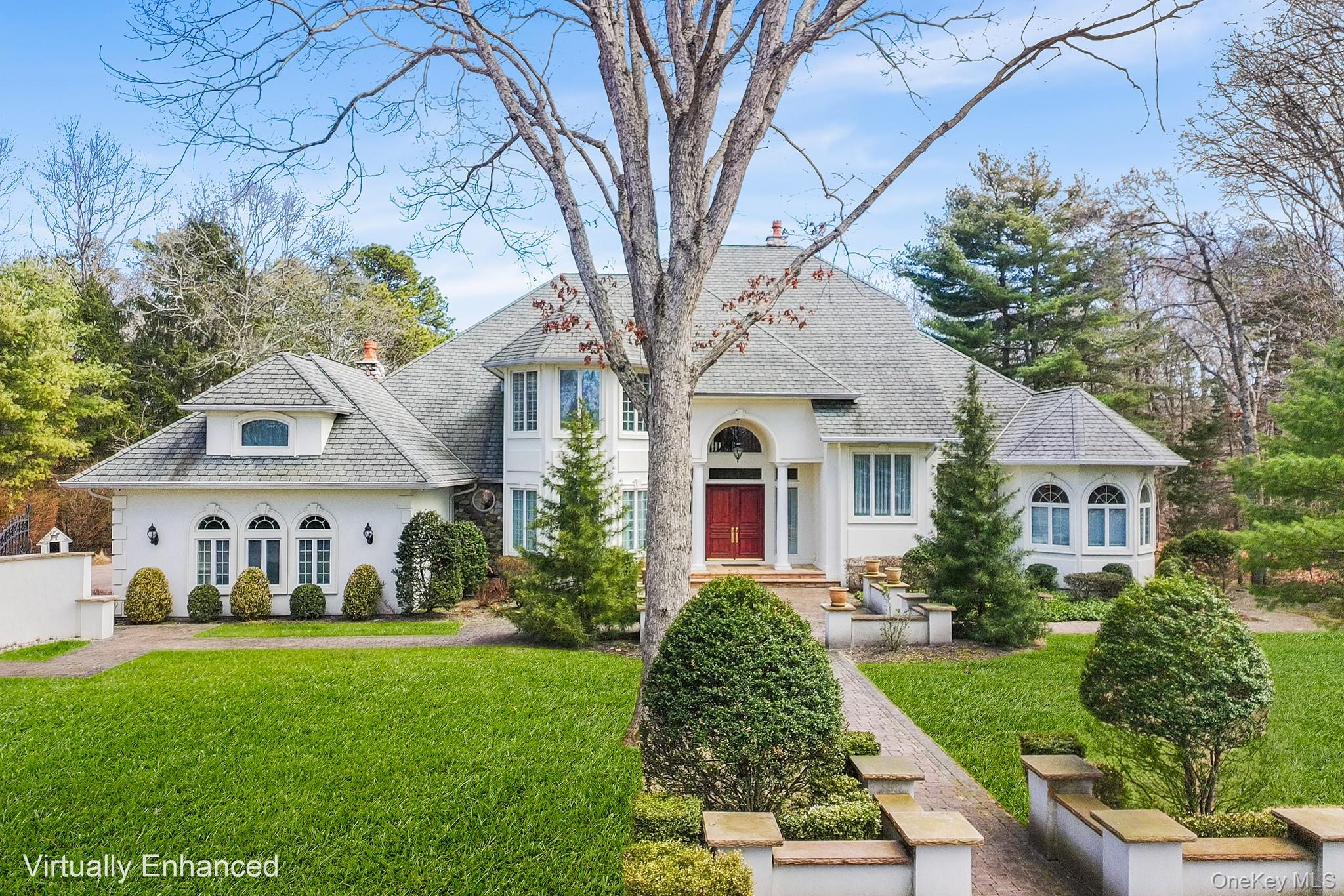 a front view of house with yard and green space