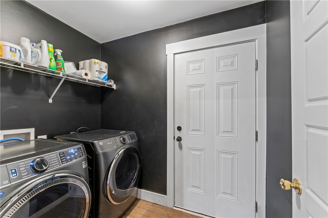 429 Nelson Drive Anderson, SC 29621 - Photo 13 of 32 A well-appointed laundry room featuring modern appliances and convenient wall shelving.