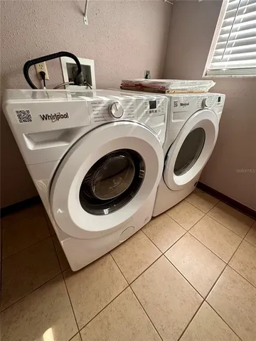 a utility room with dryer and washer