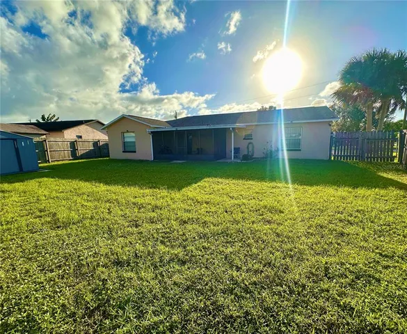 a view of a big yard next to a house