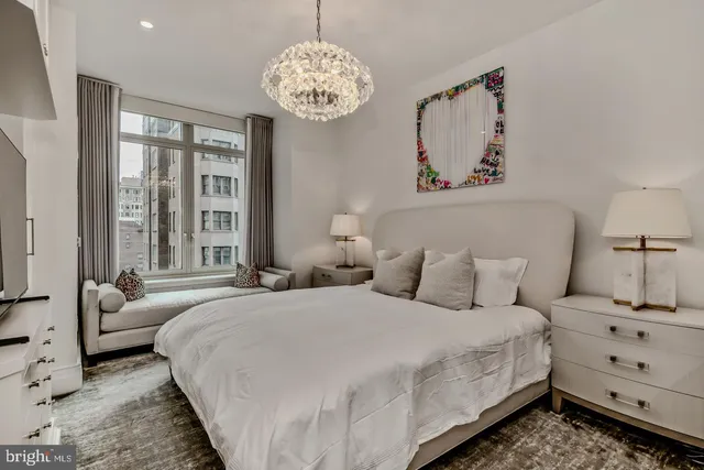 a bedroom with bed and window