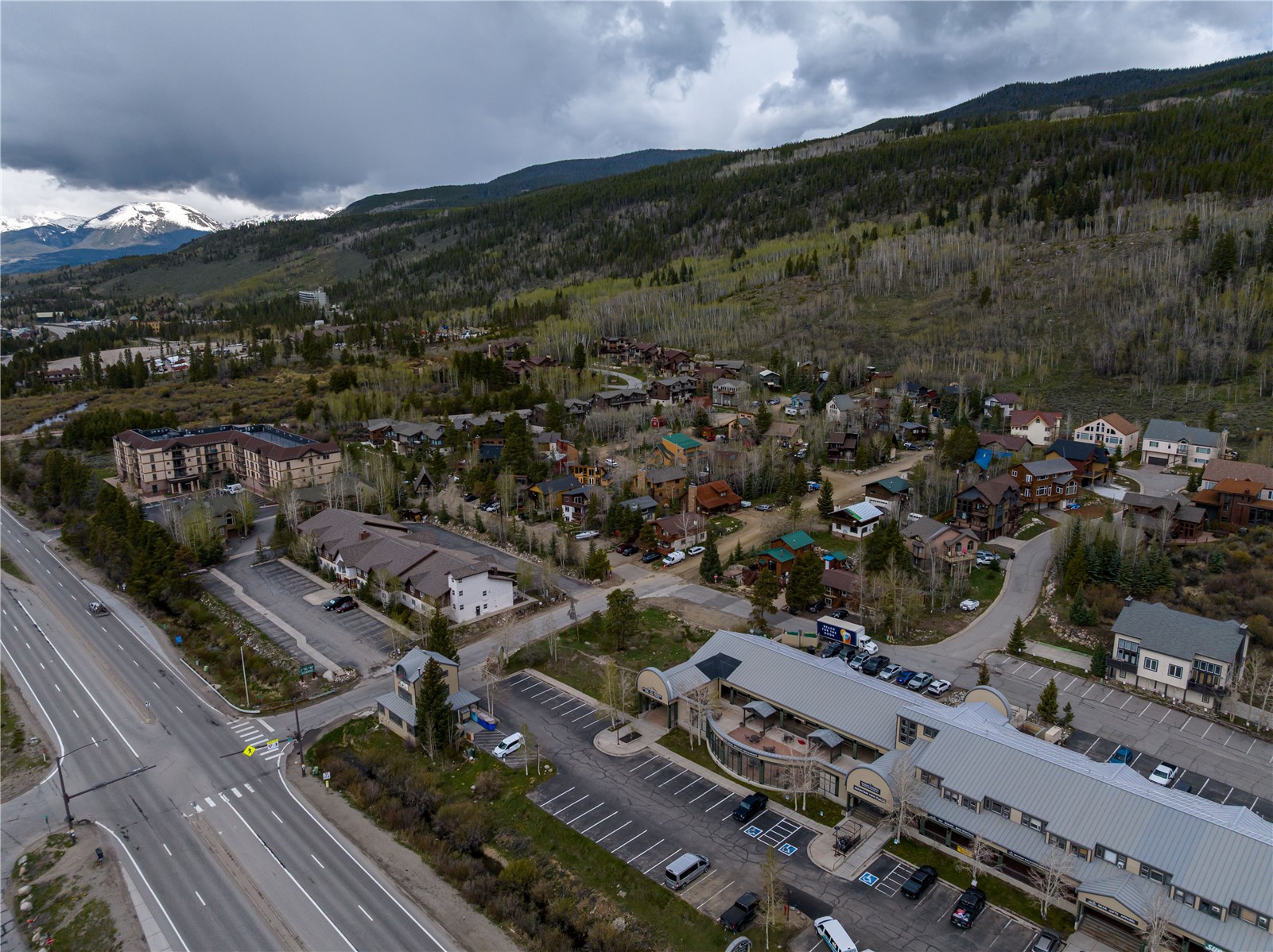57 Rasor Drive Keystone, CO 80435 - Photo 17 of 22 Aerial view of property and surrounding area with mountains, a heavily wooded area, and nearby suburban area