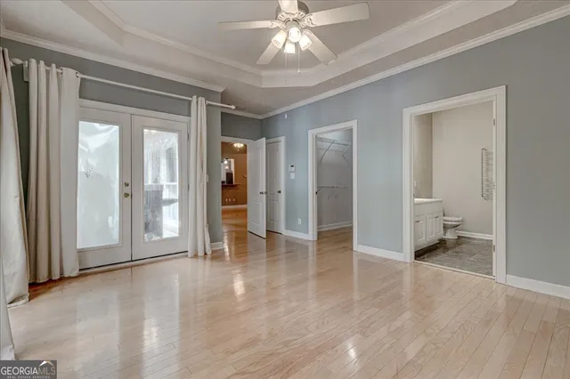 a bathroom with a tub a sink and window