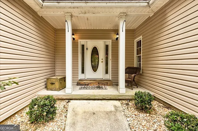 a view of an entryway with wooden floor
