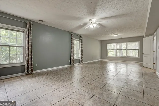 a front view of a house with a yard table and chairs