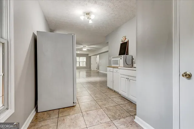 a view of a yard with a tree