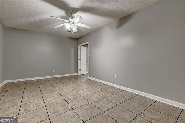 an aerial view of lake residential house with outdoor space and trees around