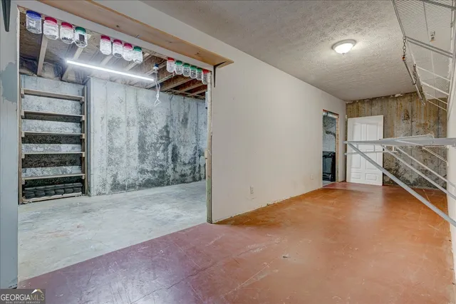 a view of a lake in middle of forest