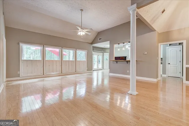 a view of an entryway with wooden floor