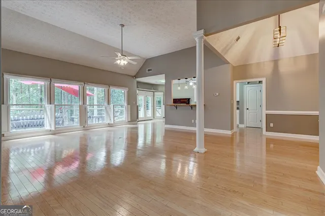 a view of a livingroom with a furniture wooden floor and window