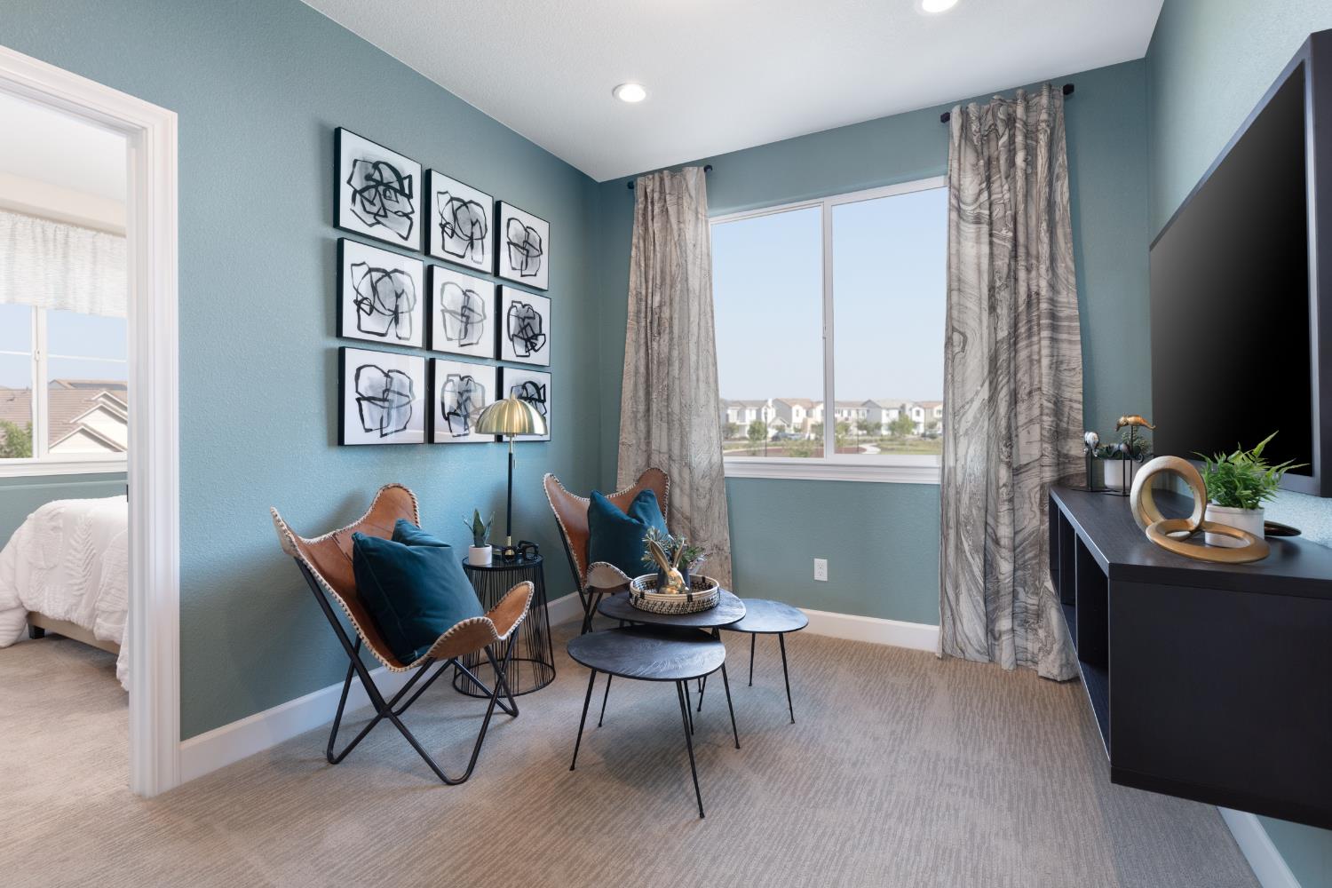 12708 Castaic Lk Way Rancho Cordova, CA 95742 - Photo 5 of 10 a living room with furniture and a flat screen tv