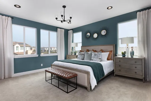 a spacious bedroom with a bed and window