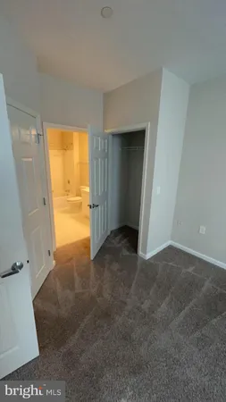 a view of an empty room and a window