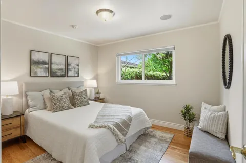 a bedroom with a bed and a couch