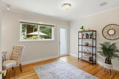 a workspace with furniture and wooden floor