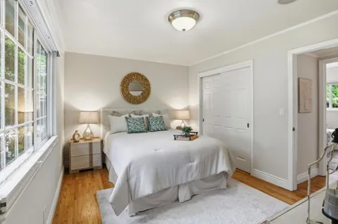 a bedroom with a bed and a table