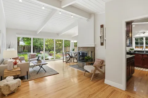 a living room with furniture and a lamp