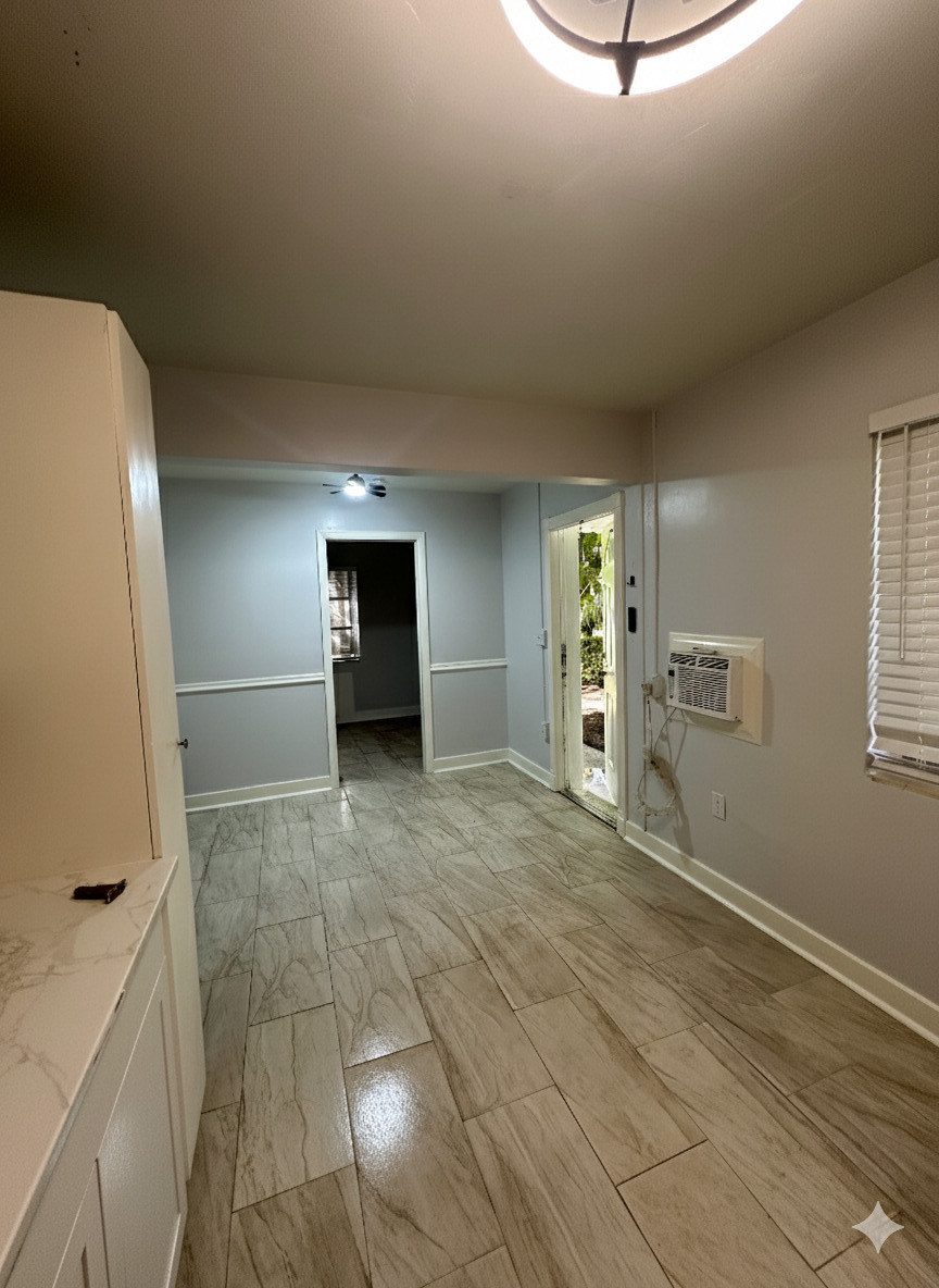 178 East 27th Street, Unit 3 Riviera Beach, FL 33404 - Photo 2 of 8 a view of an empty room with a window