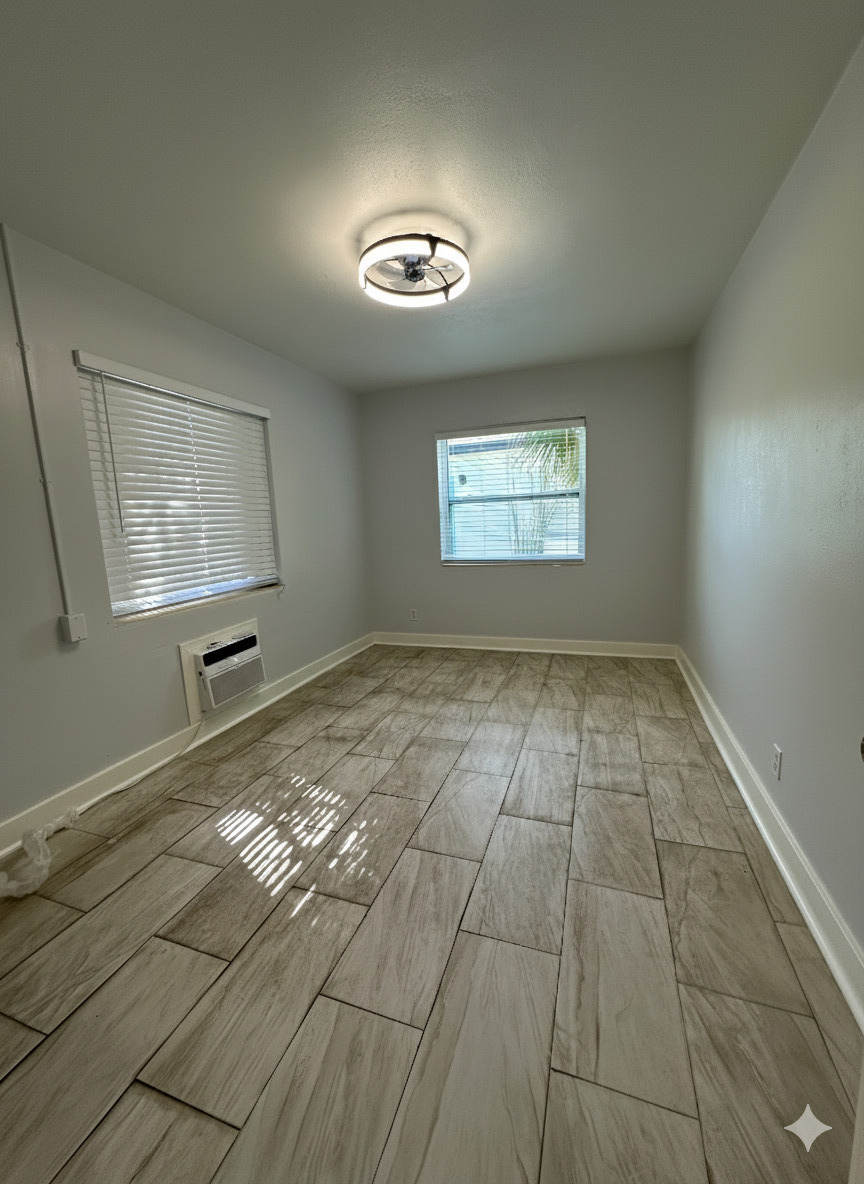 178 East 27th Street, Unit 3 Riviera Beach, FL 33404 - Photo 6 of 8 an empty room with windows