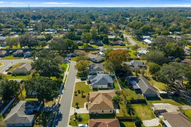 an aerial view of a house with a swimming pool