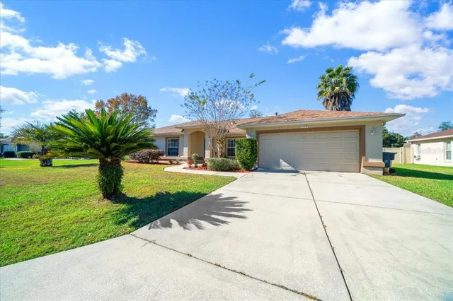 an aerial view of houses with outdoor space