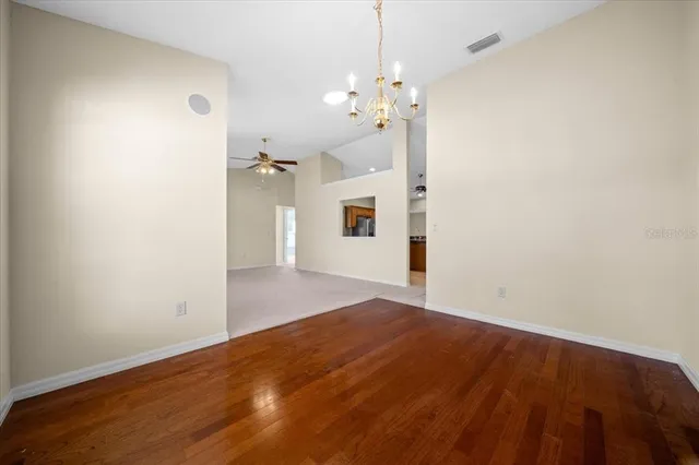 a view of a chandelier in big room and chandelier