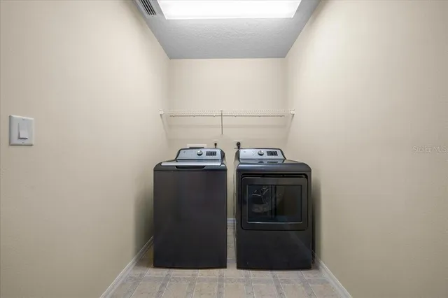 a utility room with washer and dryer