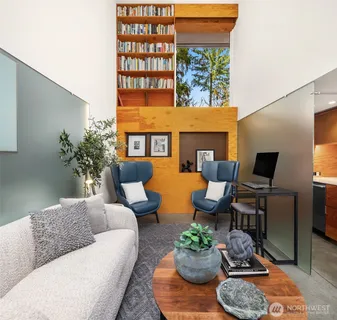 a living room with furniture fireplace and flat screen tv