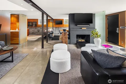 a kitchen with a table chairs and stove
