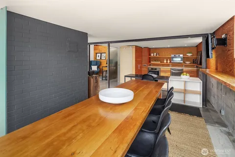 a bedroom with a bed and a table