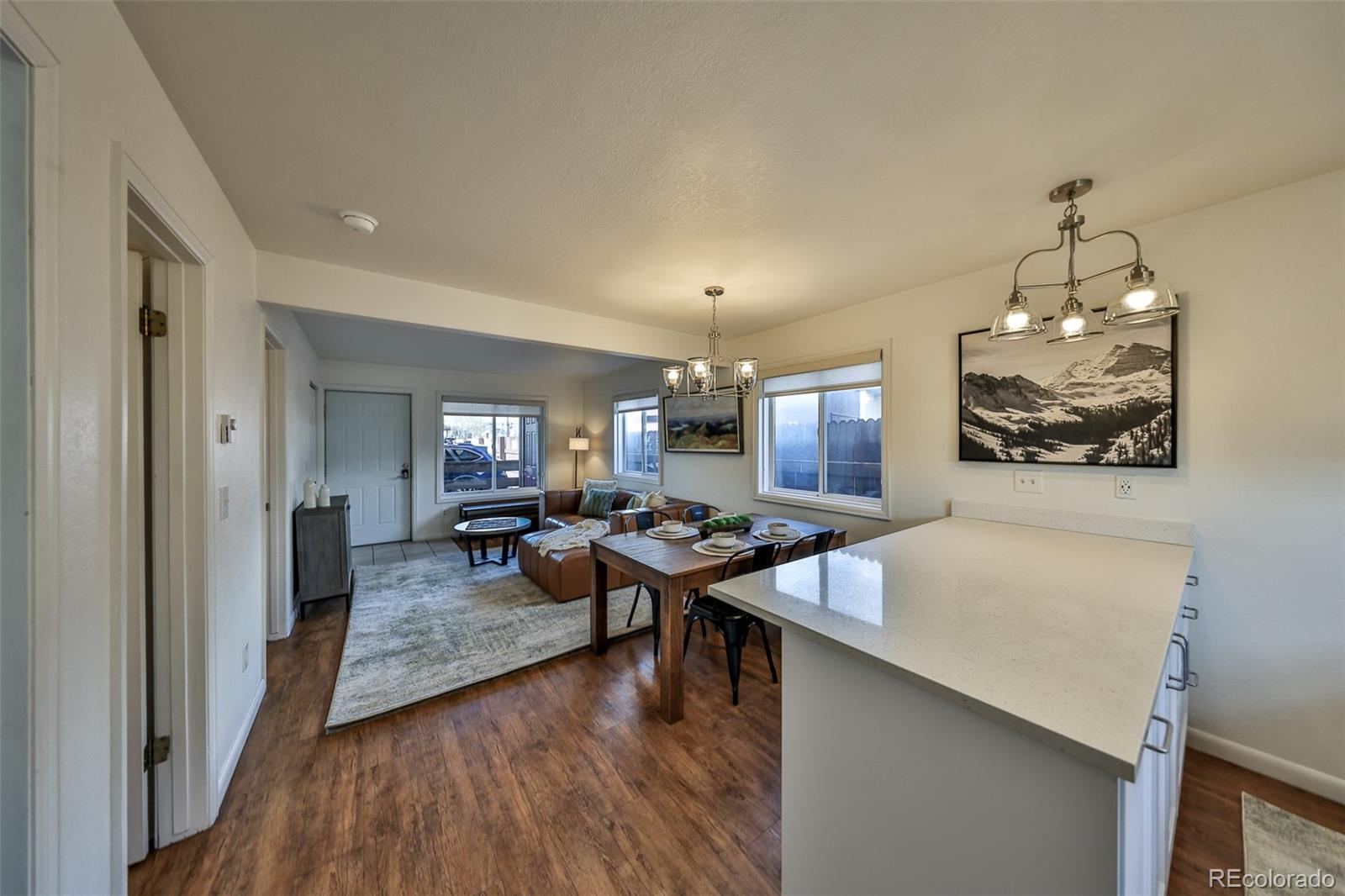233 Fraser Avenue, Unit R1 Fraser, CO 80442 - Photo 3 of 23 a living room with furniture and wooden floor