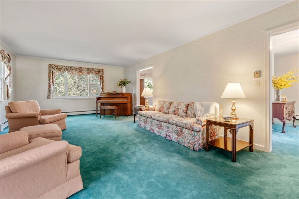 21 Pawnee Circle Milton, MA 02186 - Photo 6 of 17 a living room with furniture and a fireplace