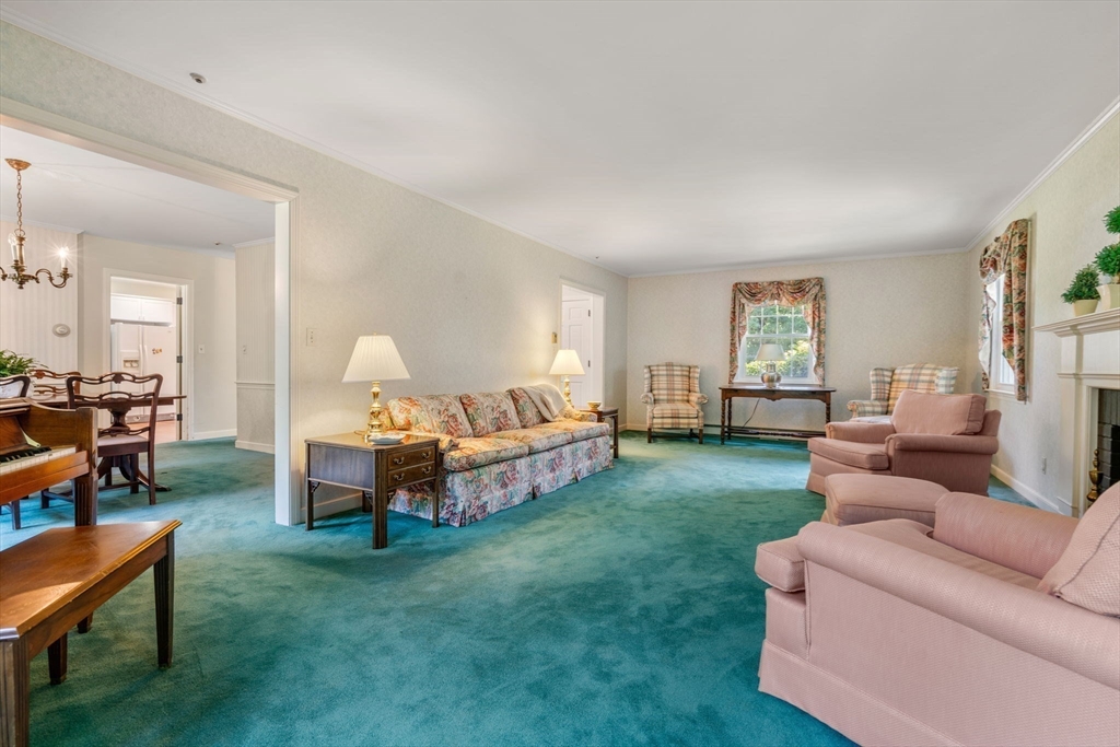 21 Pawnee Circle Milton, MA 02186 - Photo 7 of 17 a living room with furniture and a window