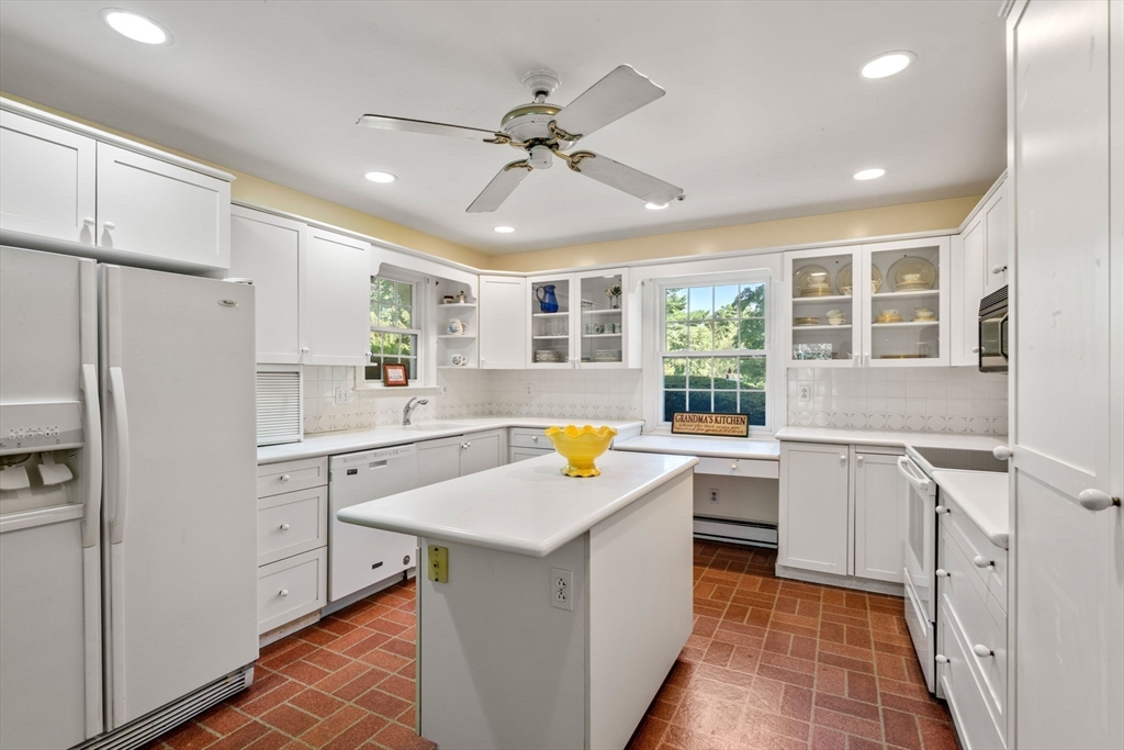 21 Pawnee Circle Milton, MA 02186 - Photo 9 of 17 a kitchen with a stove a refrigerator and a sink