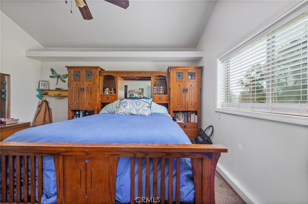 5072 Tip Top Road Mariposa, CA 95338 - Photo 11 of 41 a bedroom with a bed and wooden floor