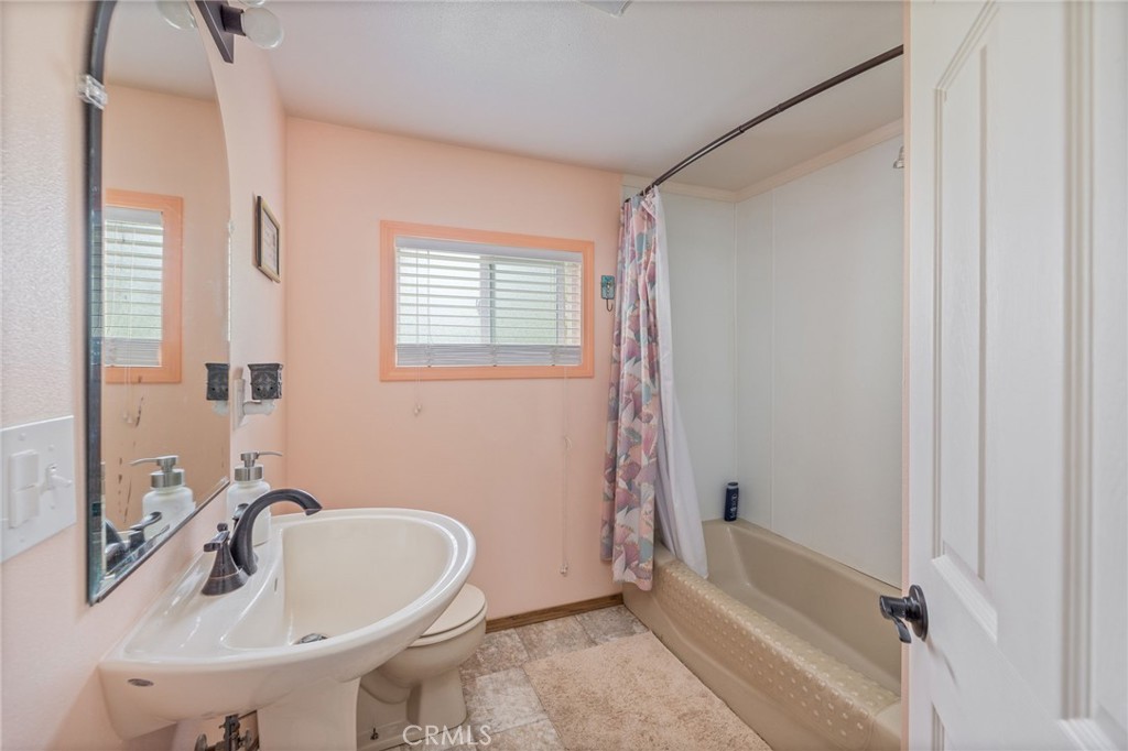5072 Tip Top Road Mariposa, CA 95338 - Photo 17 of 41 a bathroom with a sink and a bathtub