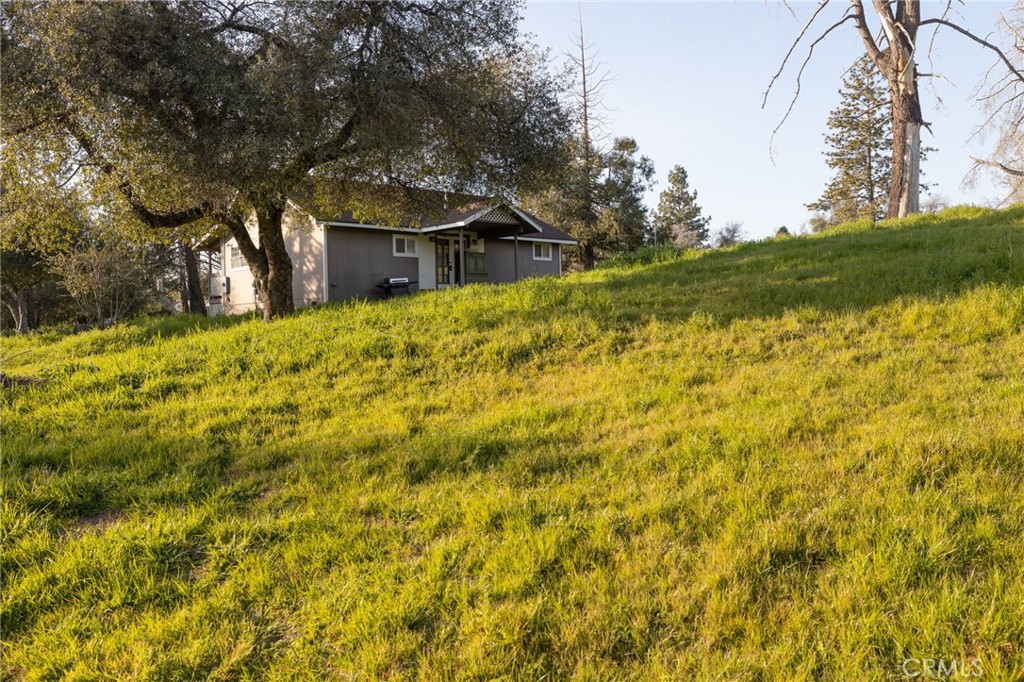5072 Tip Top Road Mariposa, CA 95338 - Photo 18 of 41 a view of a house with a yard