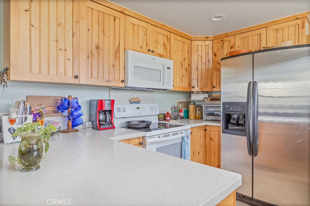 5072 Tip Top Road Mariposa, CA 95338 - Photo 3 of 41 a kitchen with refrigerator and cabinets
