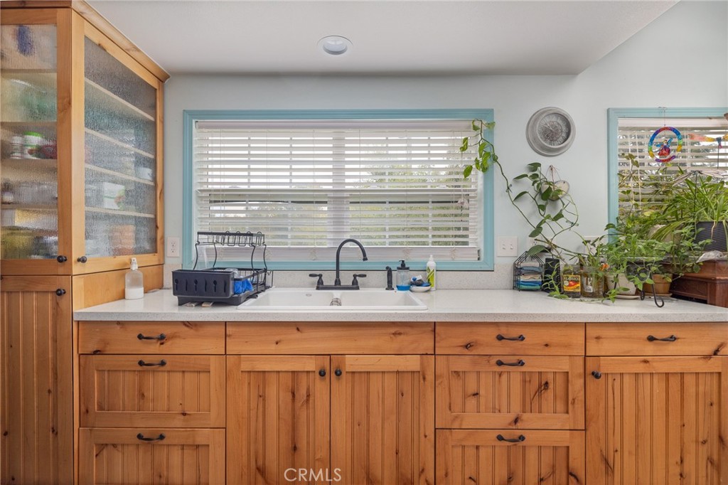 5072 Tip Top Road Mariposa, CA 95338 - Photo 4 of 41 a kitchen with stainless steel appliances kitchen island granite countertop a sink and a white wooden cabinets
